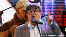 FARC leader Rodrigo Londono, known by his nom de guerre Timochenko, speaks during the launching of the new polÄÄitical party called the Revolutionary Alternative Common Force, at the Plaza de Bolivar in Bogota