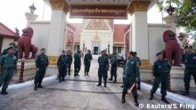 Police stand guard outside Cambodia's Supreme Court