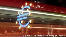 The euro symbol with red lights streaking through it